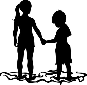 silhouette of a brother and sister holding hands at the beach